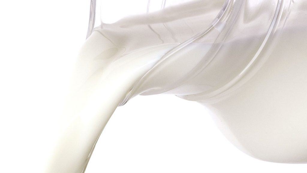 Pouring cream from jug 