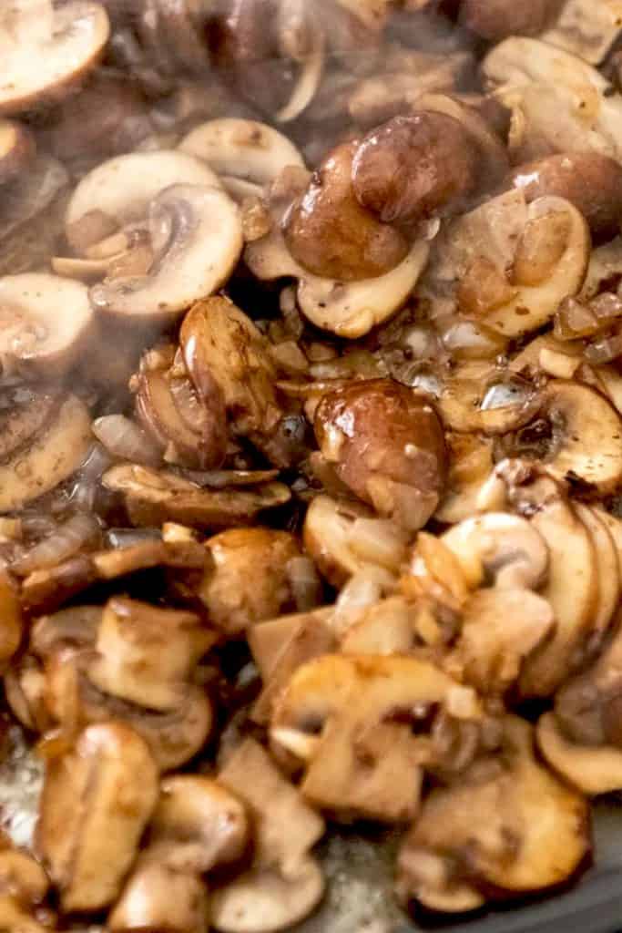 mushrooms frying in a pan