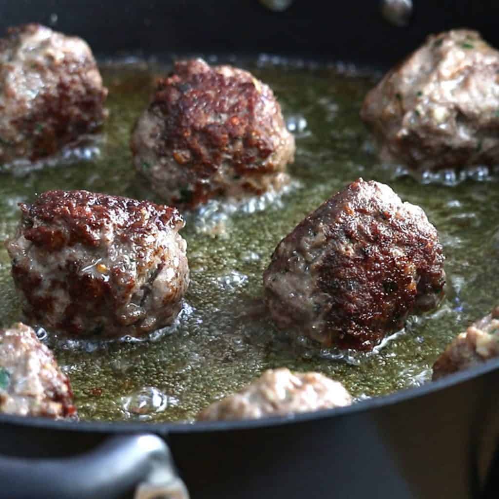 meatballs pan frying.