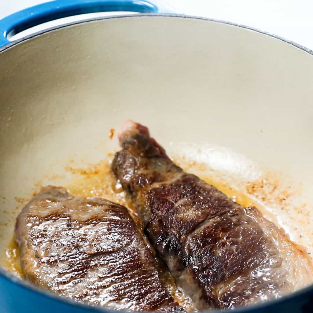short ribs browning in a pot