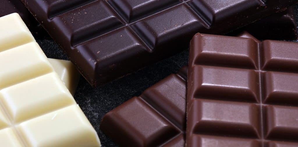 chocolate in diffrent color. milk, dark and white chocolate bars.