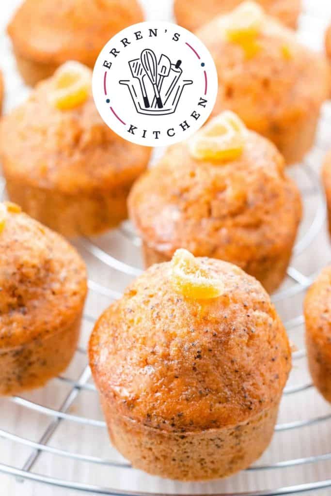 orange poppy seed cakes on a cake rack