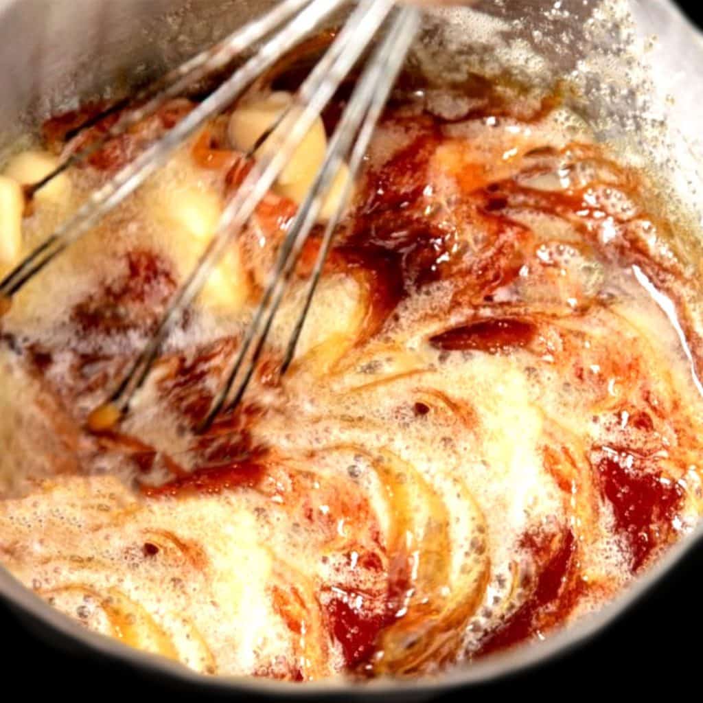 Butter being mixed into the sugar mixture