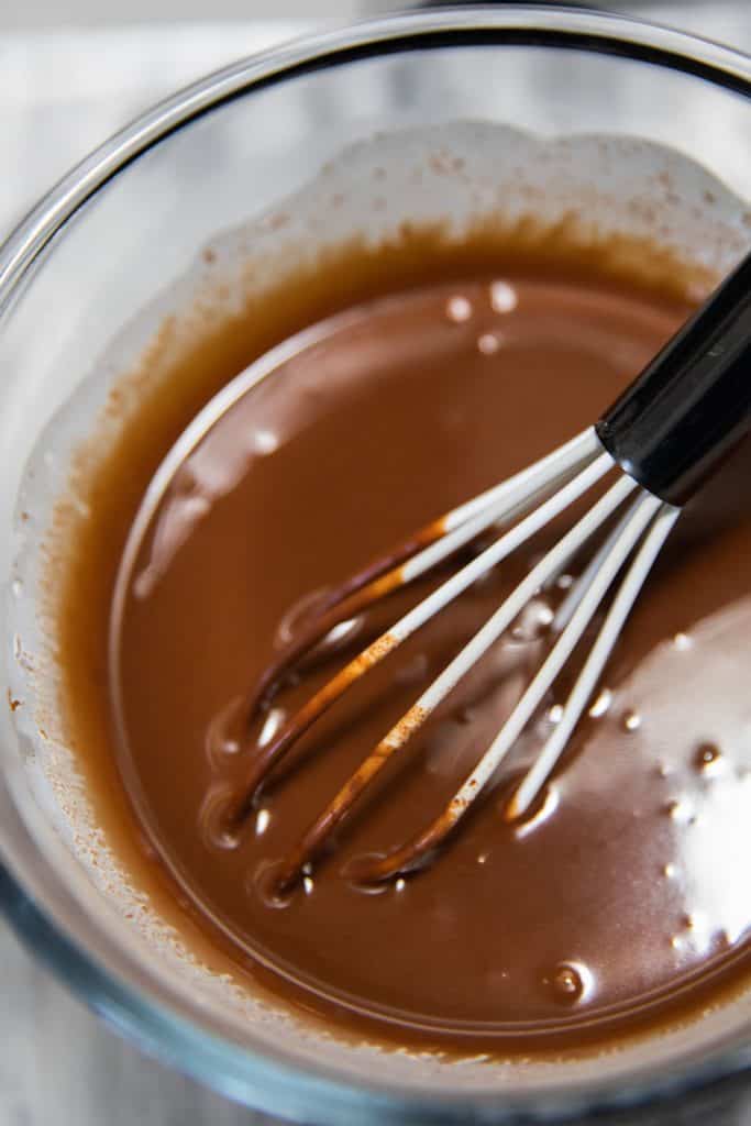 chocolate and cream being mixed together.