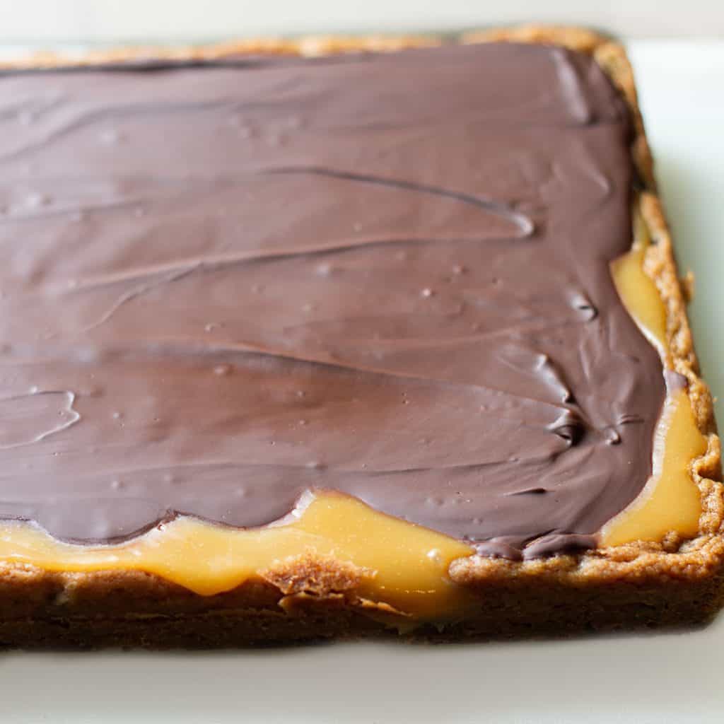 a cookie bade covered in caramel and chocolate