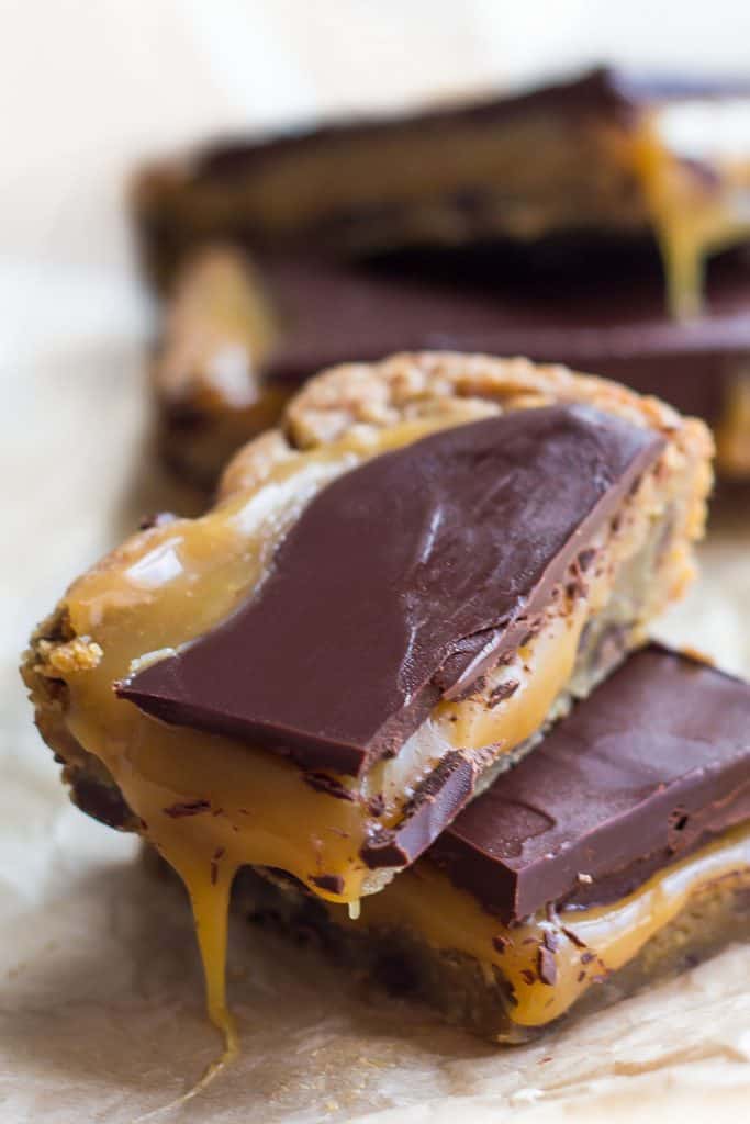 A plie of salted caramel blondies bars oozing with caramel