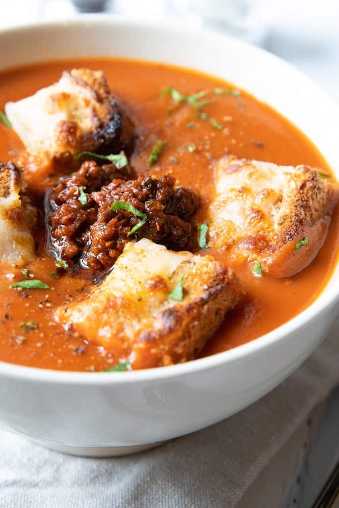 Tomato Pesto Soup topped with cheesy croutons