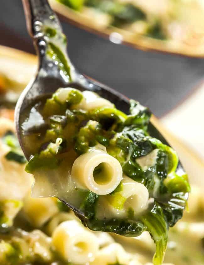 a spoonful of escarole soup with pasta