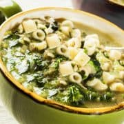 a bowl of escarole soup with pasta