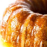 An orange cake covered in the wet claze