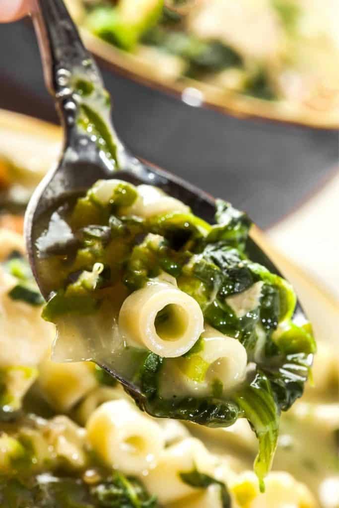 escarole soup ready to eat on a spoon