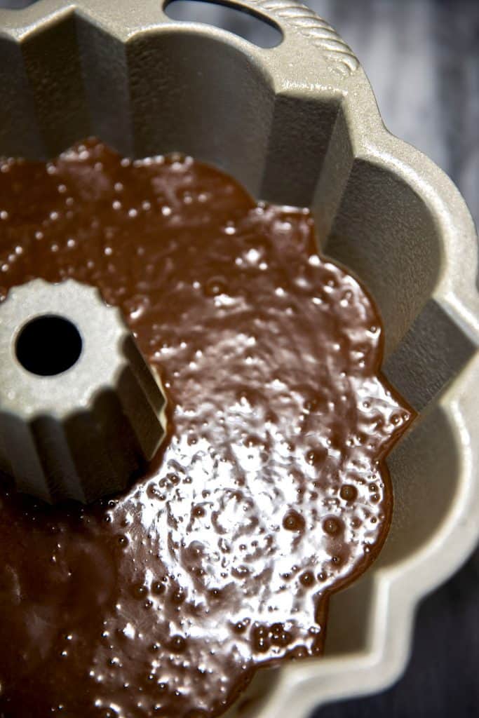 chocolate cake batter in a pan ready to go in the oven