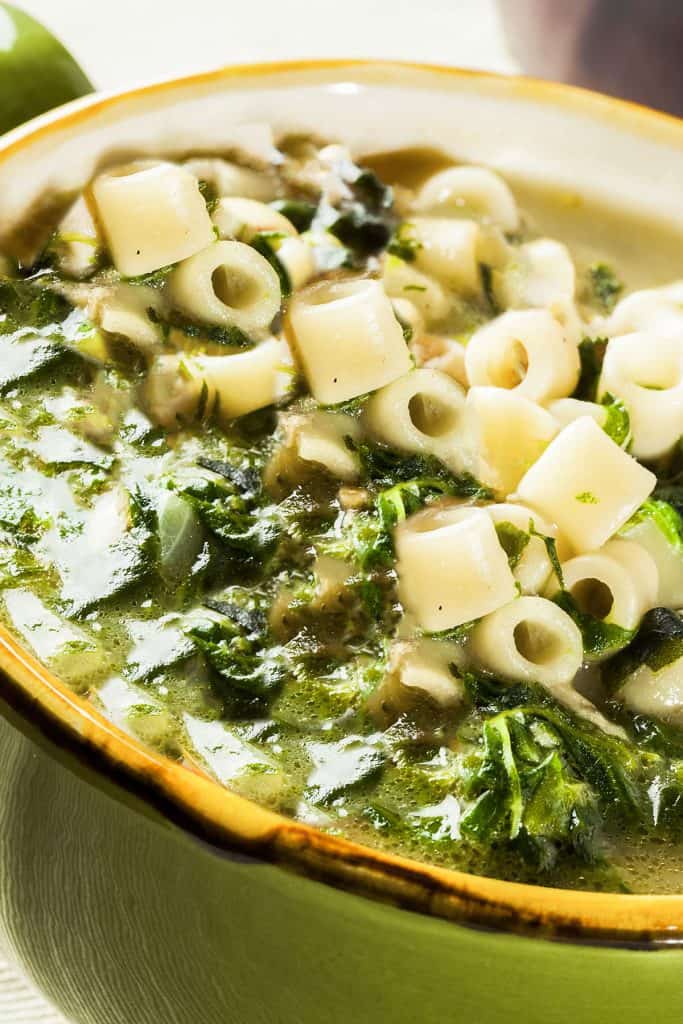 a bowl of escarole soup with pasta