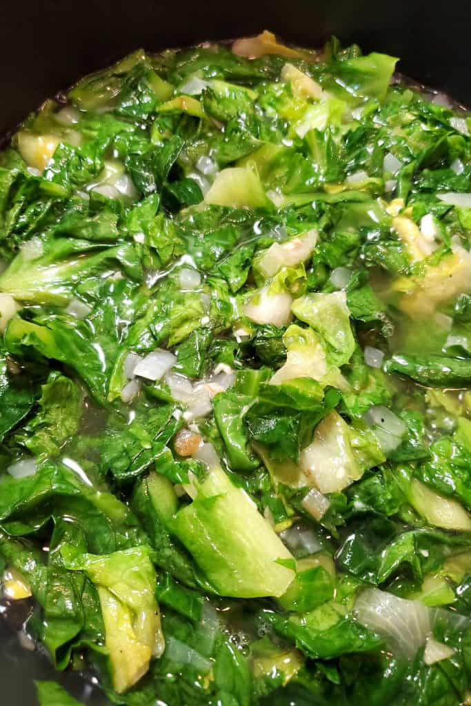 the escarole added to the stock mixture