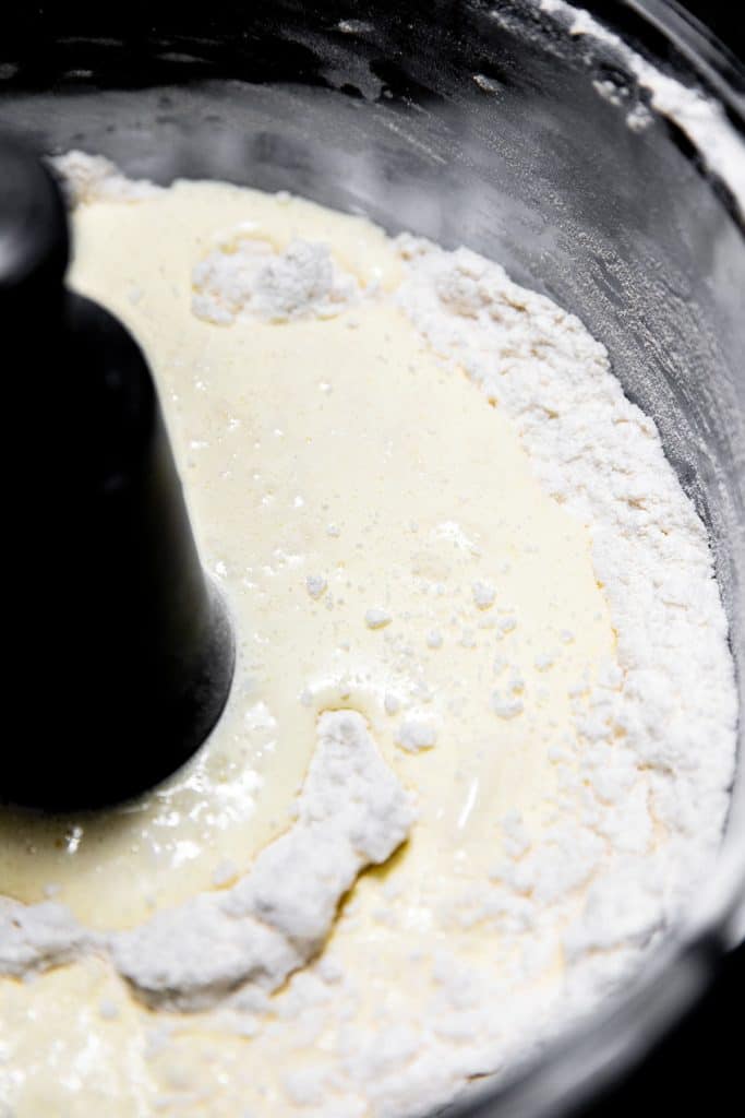 adding the wet mix to the dry mix in the blender