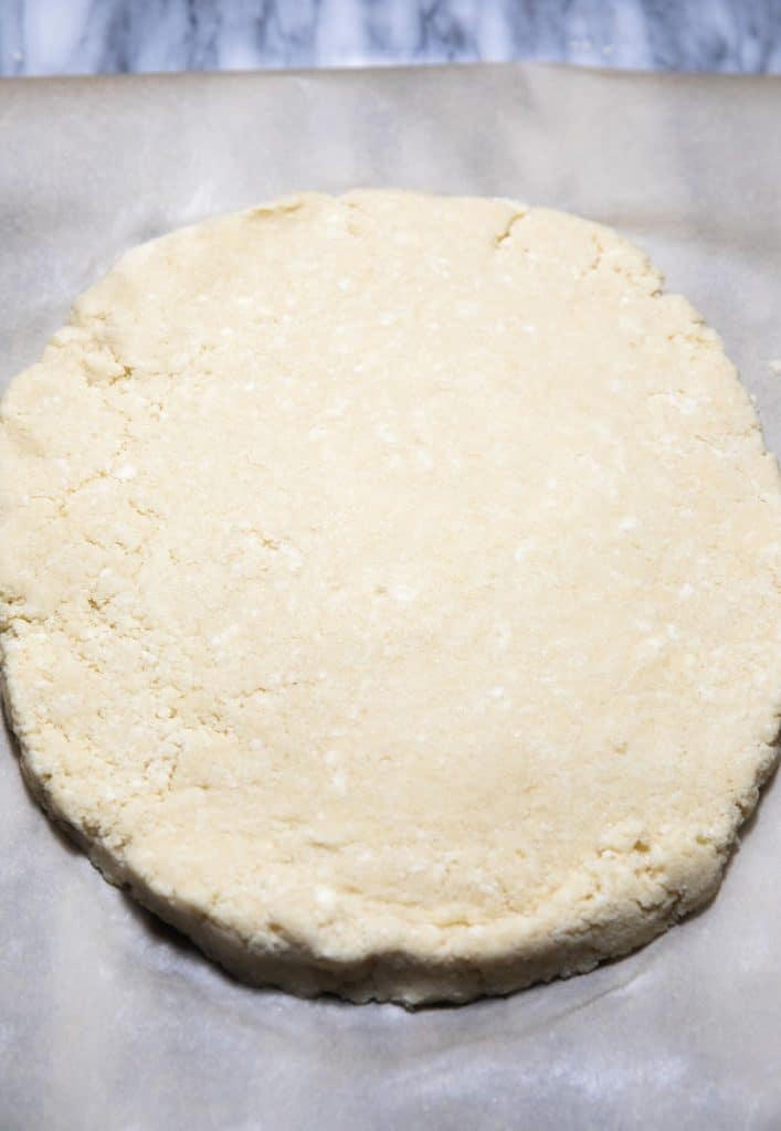 scone dough in a round shape ready to bake