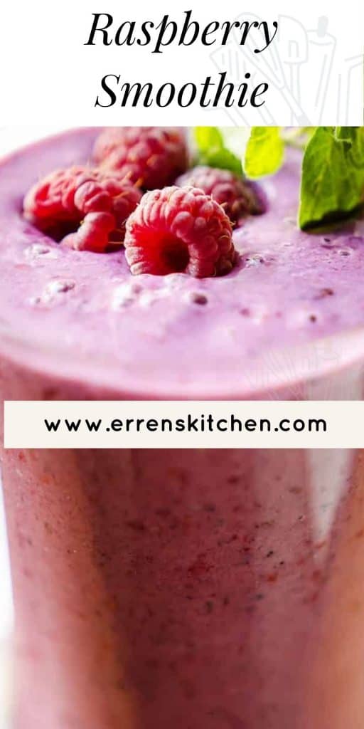 a raspberry smoothie in a glass garnished with fresh raspberries and mint leaves