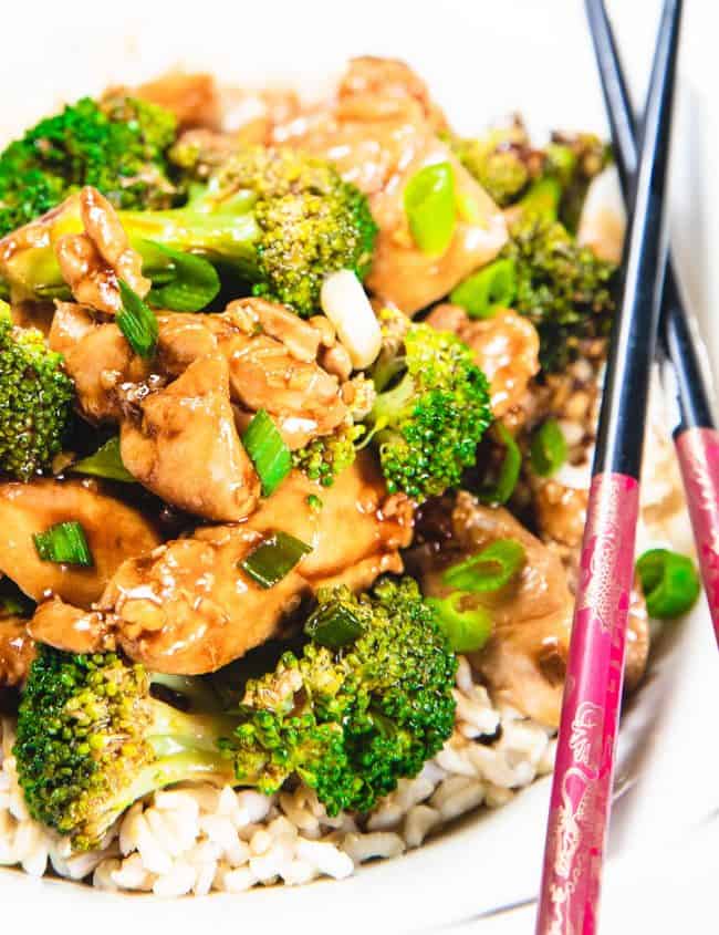 Chocpsticks on a plate with a chicken and broccoli stir-fry