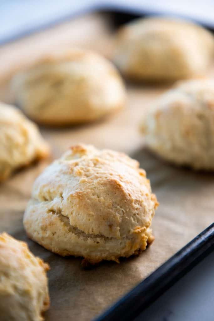 drop biscuits lined up on a tray straight out of the oven