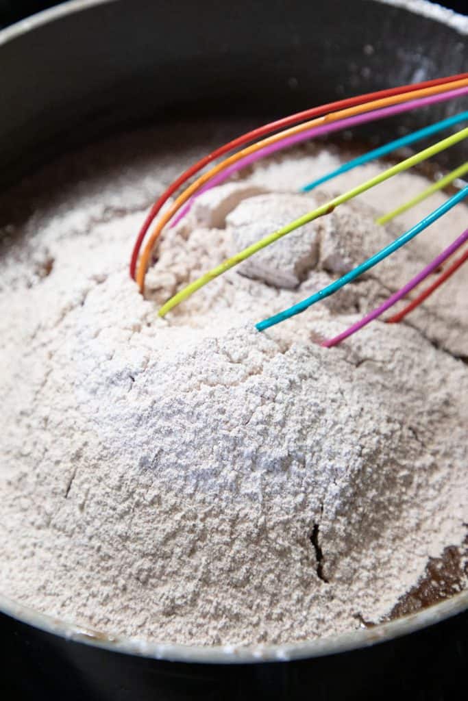 the sugar and cocoa powder sifted into the pot with the chocolate mixture