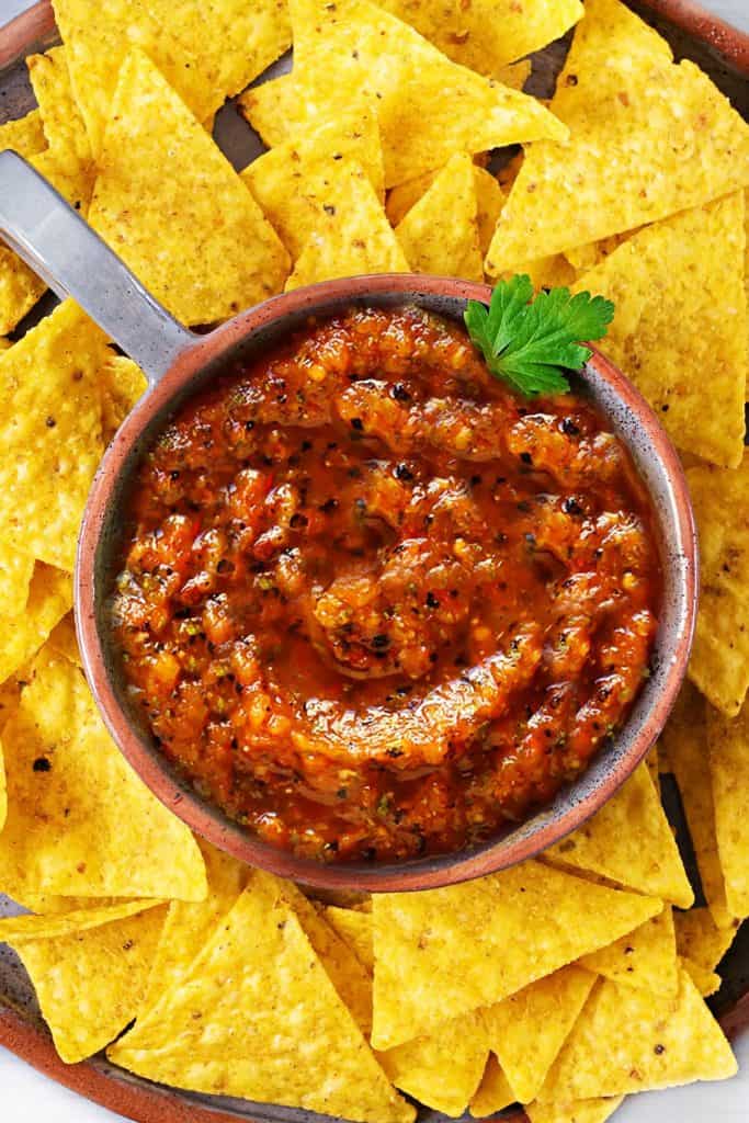 tomato salsa surrounded with tortilla chips