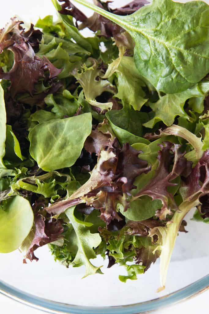 a bowl full of salad greens