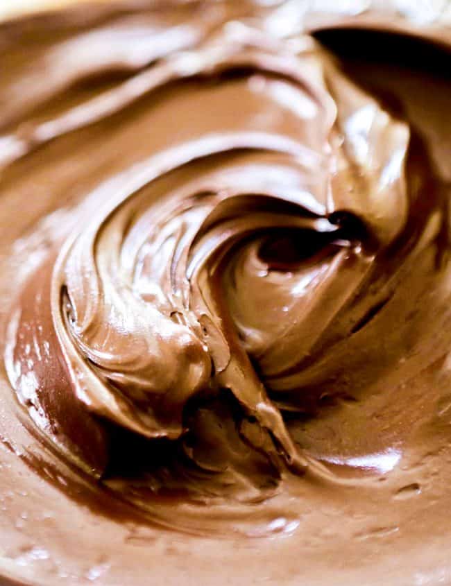a close up of chocolate frosting in a bowl