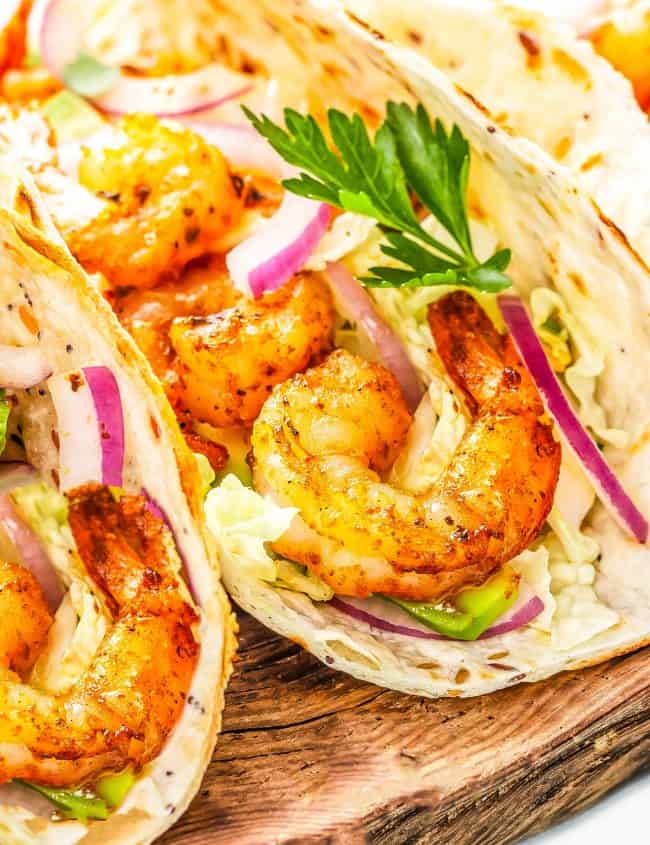 Shrimp Tacos on wooden cutting board
