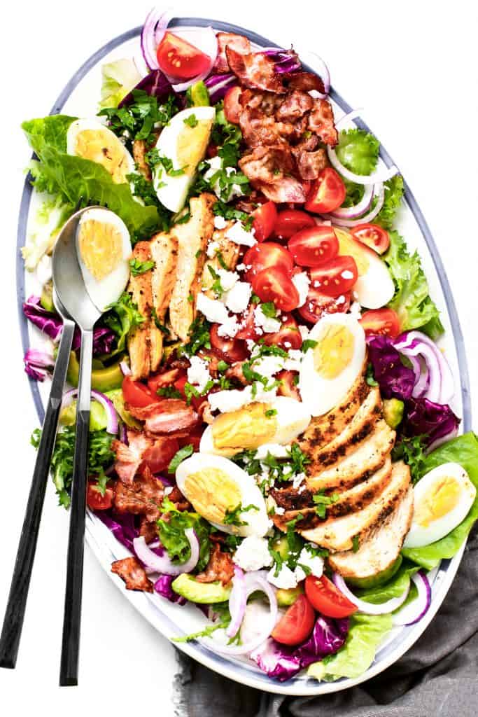 Homemade Cobb salad served in an oval dish, overhead view