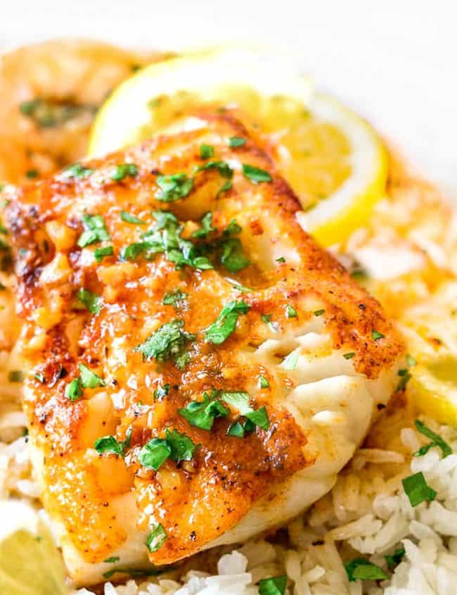 cod in garlic butter sauce with lemon slices