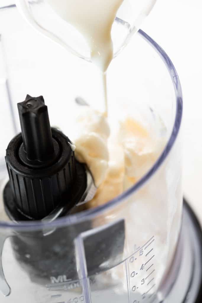 buttermilk being poured into mixer