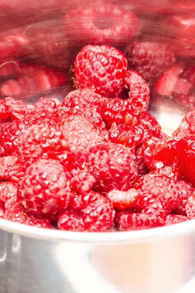 raspberries added to a saucepan