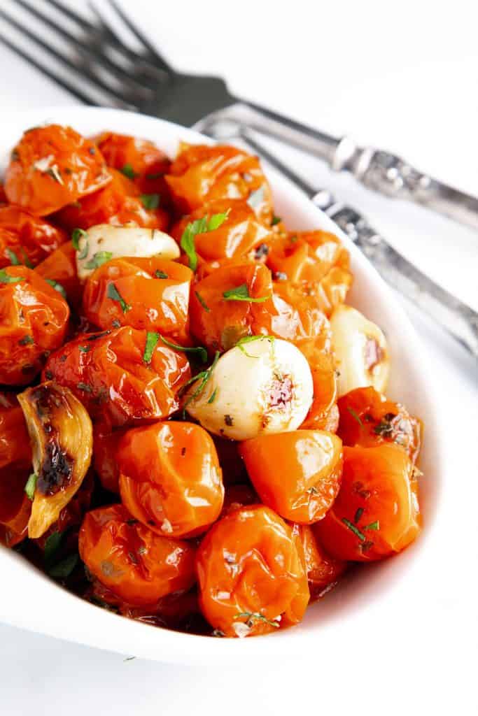 a bowl of roasted cherry tomatoes ready to serve