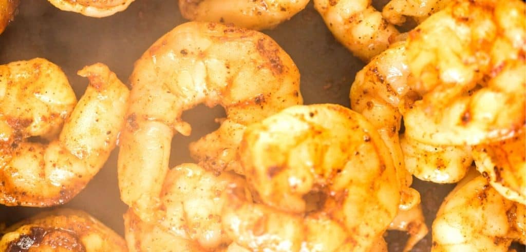 shrimp cooking in a pan