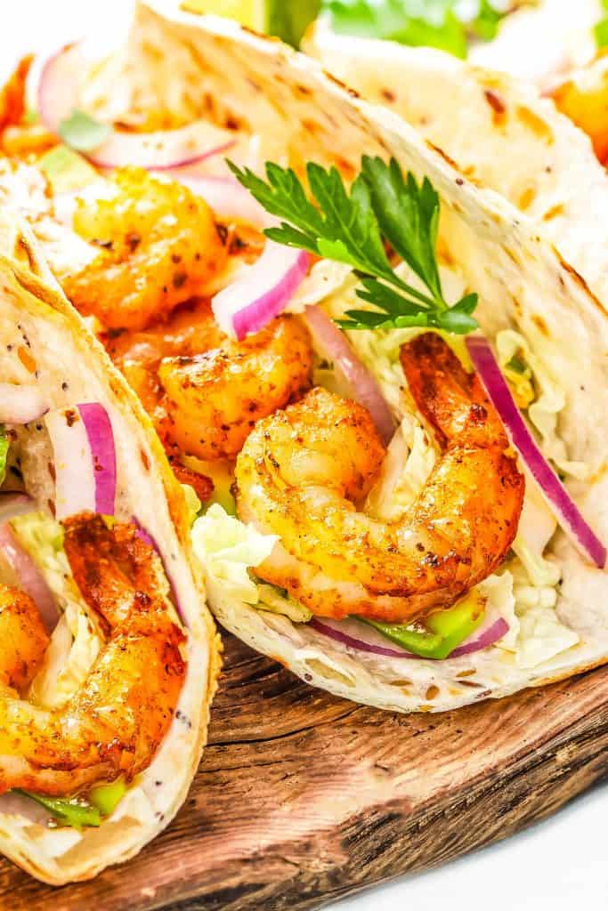 Shrimp Tacos on wooden cutting board
