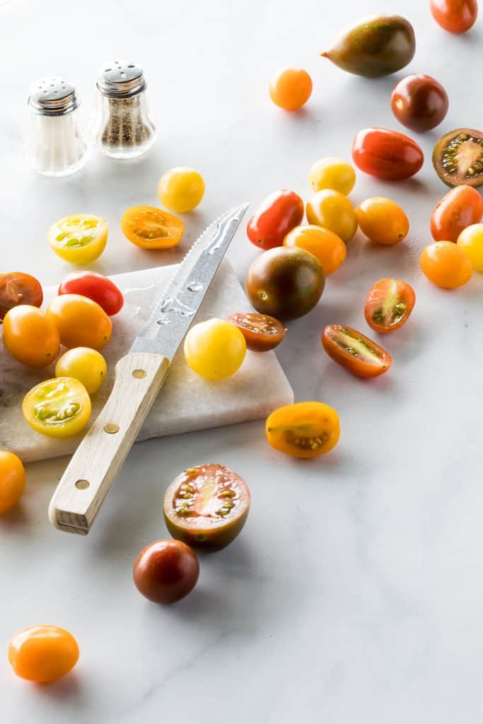 Juicy cherry tomatoes being prepped for eating