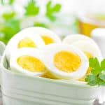 halved hard boiled eggs in a bowl