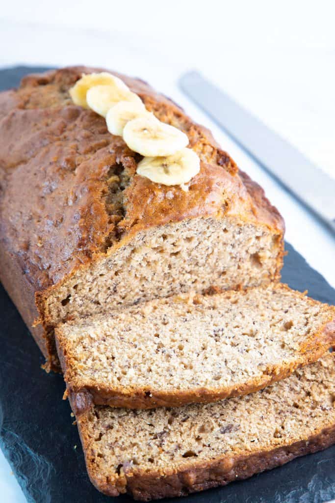 a banana bread loaf sliced and ready to eat