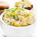 Egg salad with chives on a wooden background. Selective focus.
