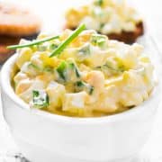 Egg salad with chives on a wooden background. Selective focus.