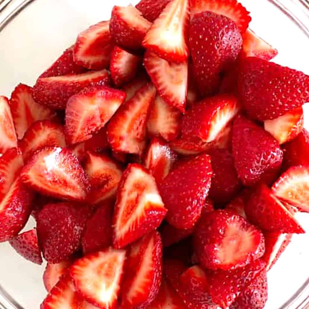 a bowl of sliced strawberries