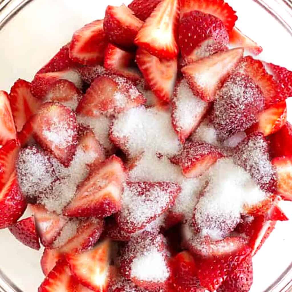 strawberries and sugar in a bowl