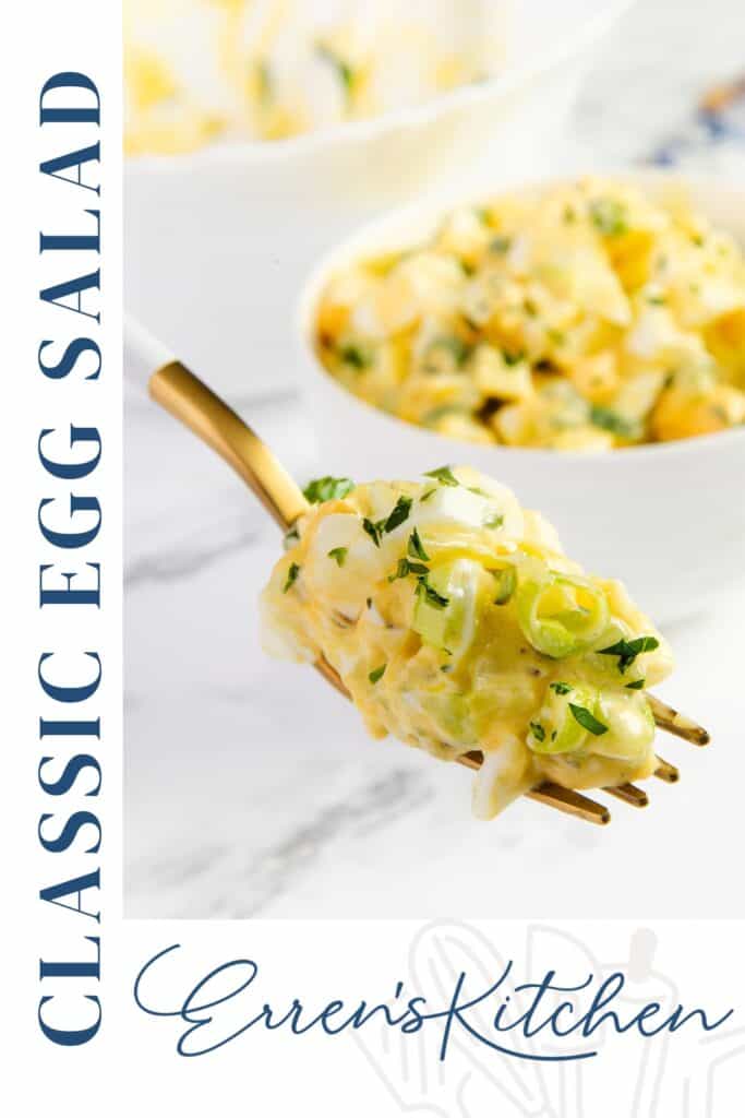 A close-up of a fork holding a bite of creamy Egg Salad garnished with herbs, with a bowl of egg salad in the background. Text on the image reads "Classic Egg Salad" and "Erren's Kitchen.