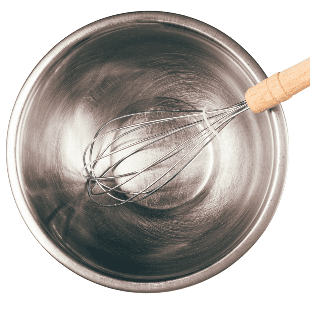 a whisk in a mixing bowl
