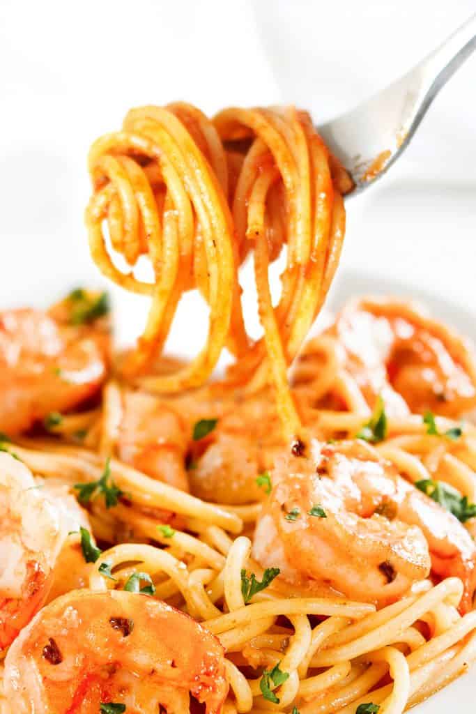 spicy shrimp spaghetti twirled on a fork