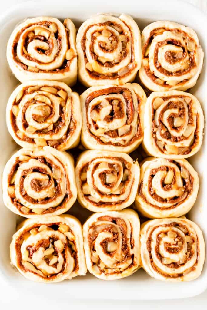 The risen Cinnamon Rolls With Apple Pie Filling in the pan ready to bake.