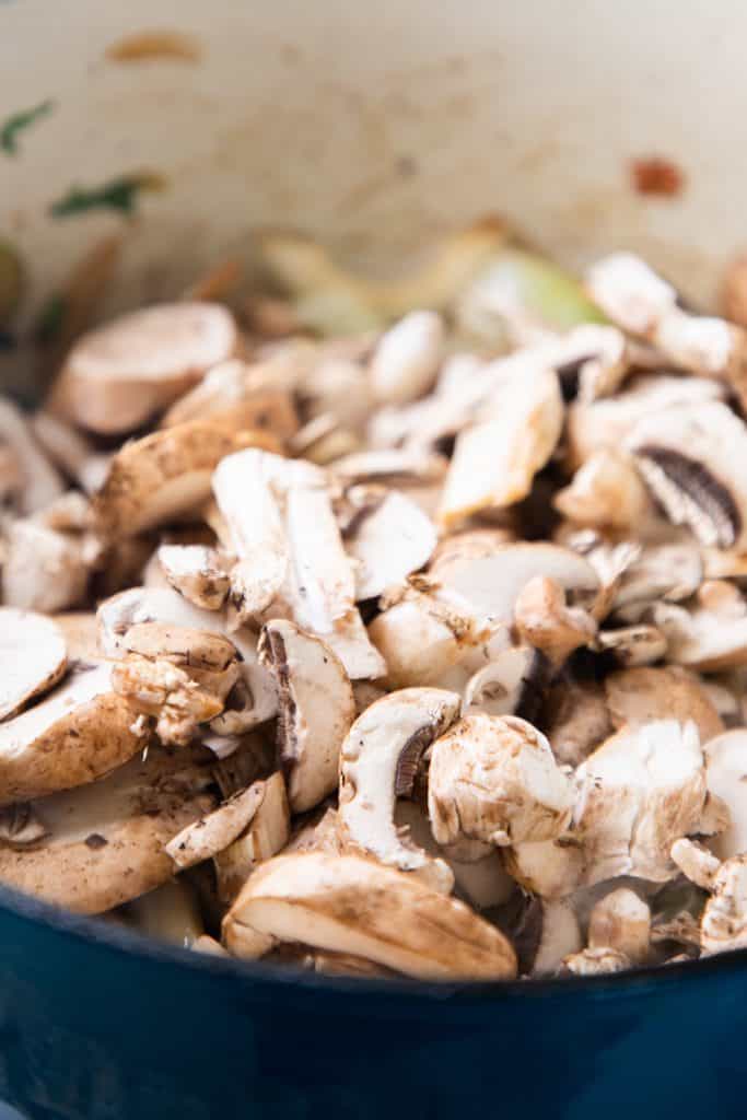 Mushrooms added to the pan with the onion mixture.