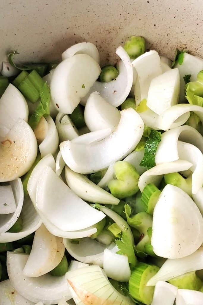 sliced vegetables in a dutch oven dish