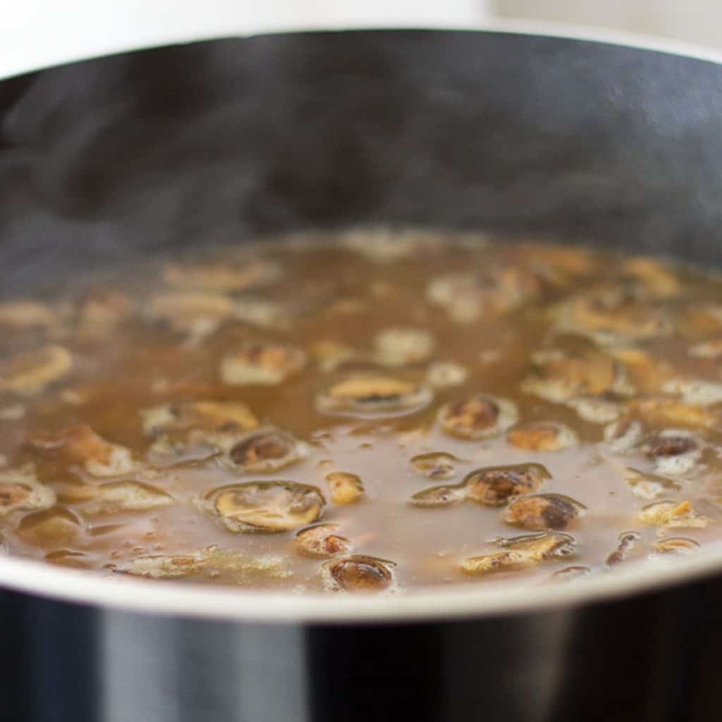 mushrooms cooking in stock