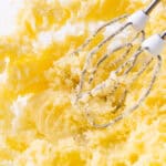 Bowl of light and fluffy creamed butter and sugar mixture, freshly blended with an electric mixer.